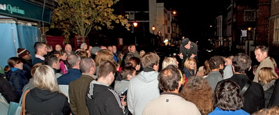 Outside The Three Pigeons about to hear a cheese story